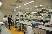 The working group members tour a typical research laboratory with standard setting for individual investigators in our School